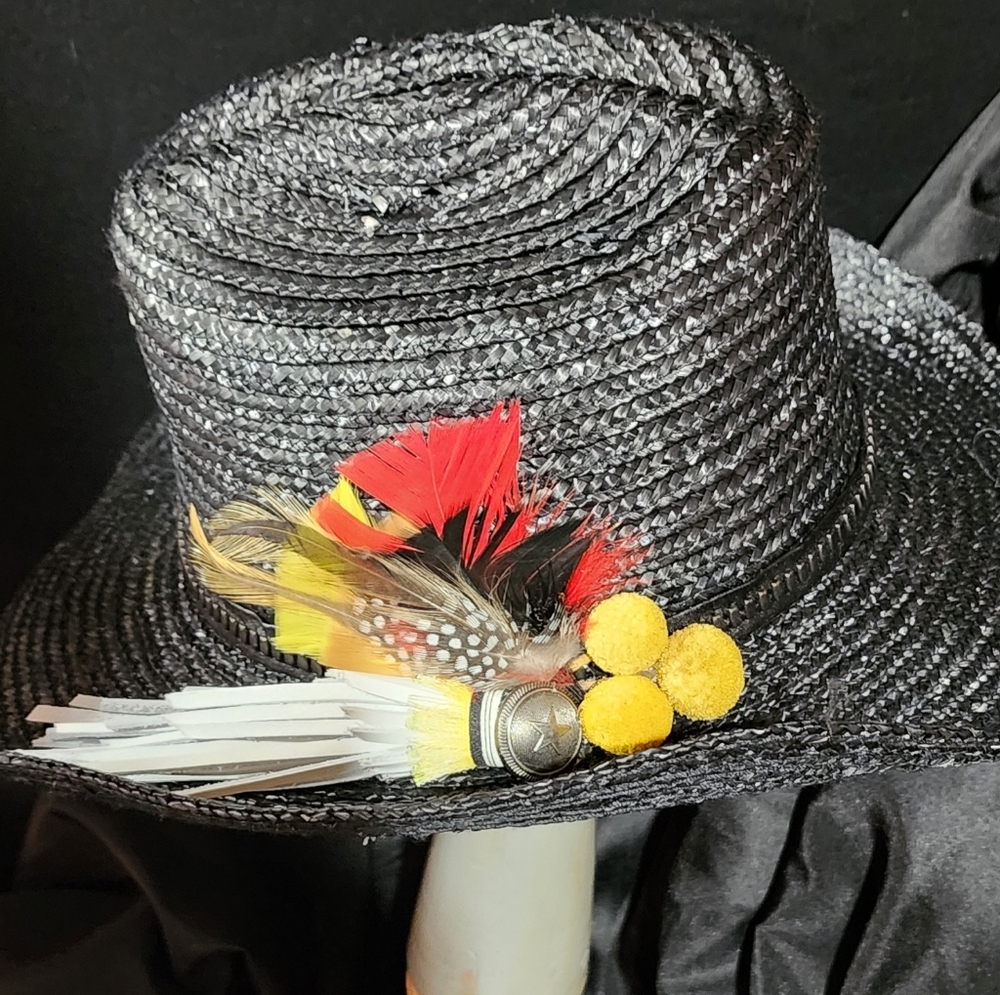 New, Free People hat with original decorations.